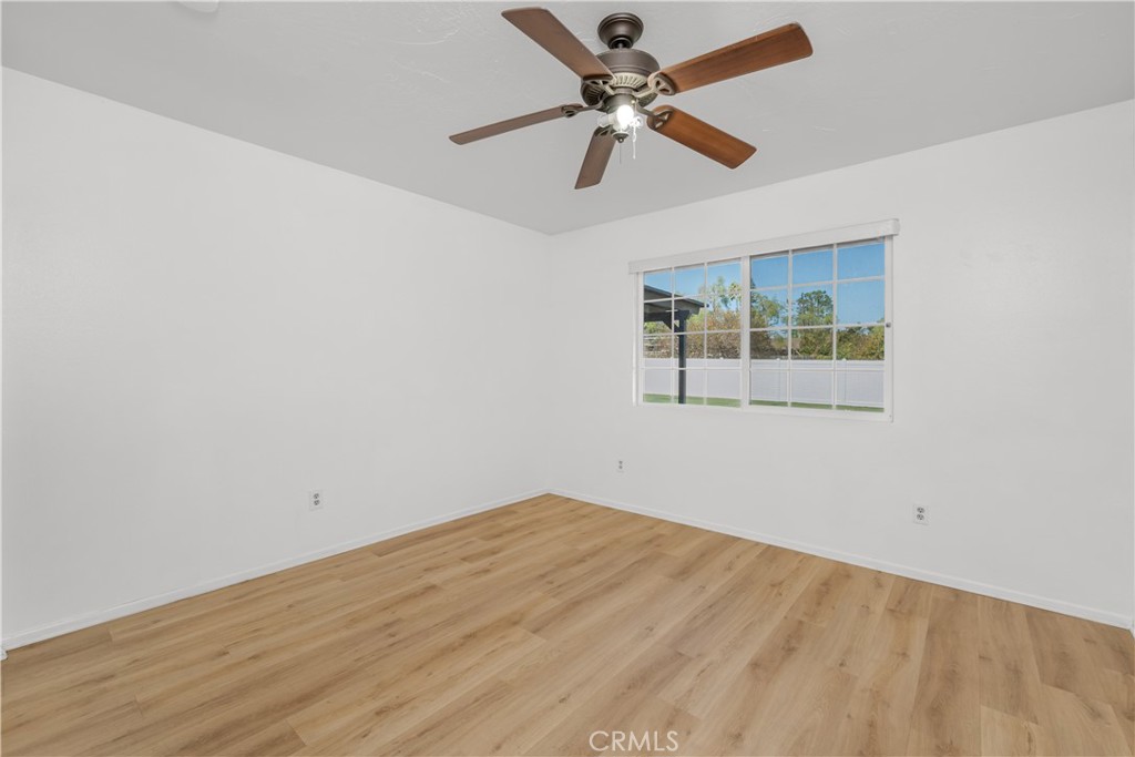 16810 Tava Lane Riverside, CA 92504 - Photo 18 of 33 a view of empty room with wooden floor