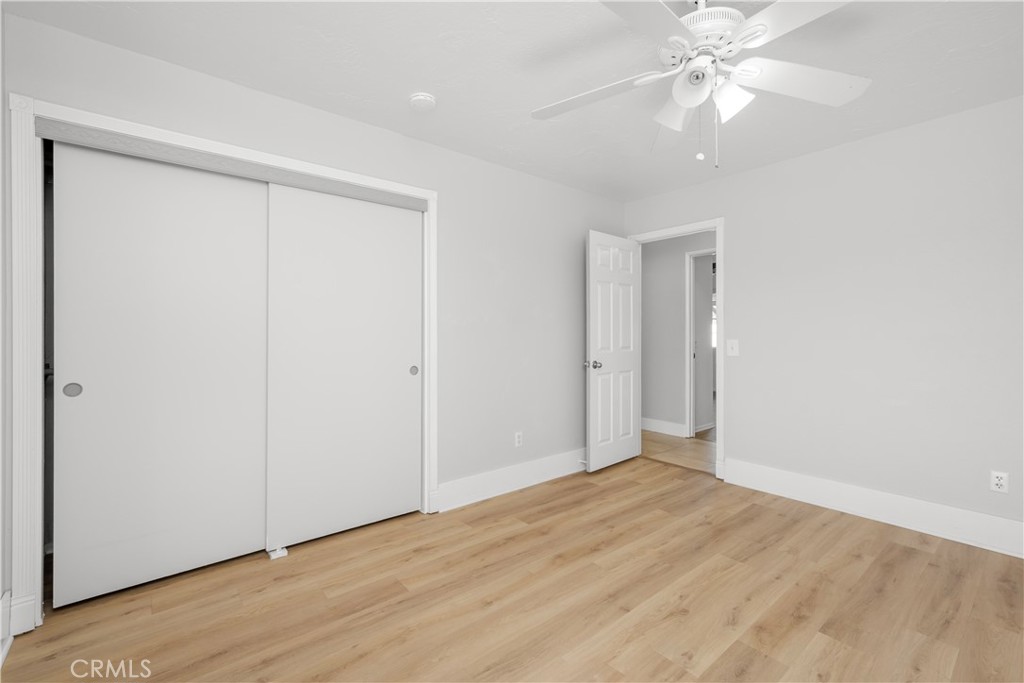 16810 Tava Lane Riverside, CA 92504 - Photo 21 of 33 a view of an empty room with wooden floor