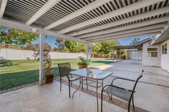 a view of a backyard with an outdoor space