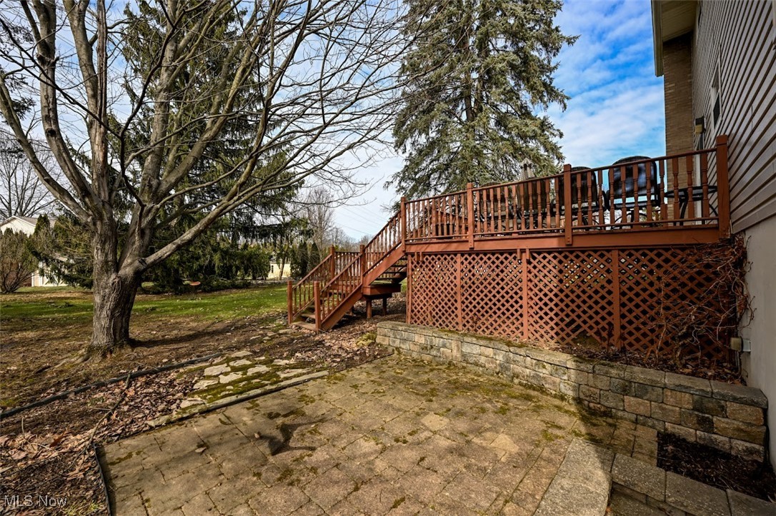 3305 Edington Road Akron, OH 44333 - Photo 45 of 46 View of yard featuring a patio area, stairway, and a deck