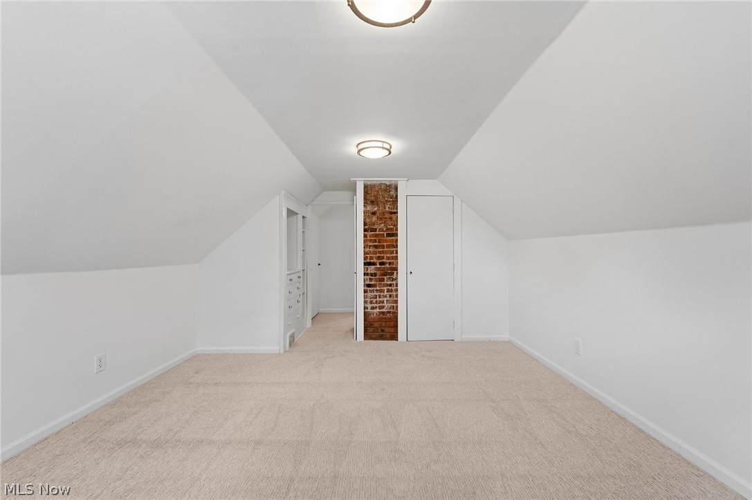 7750 Lewis Road Olmsted Falls, OH 44138 - Photo 32 of 50 Attic room featuring neutral carpeting, sloped ceilings, and recessed lighting