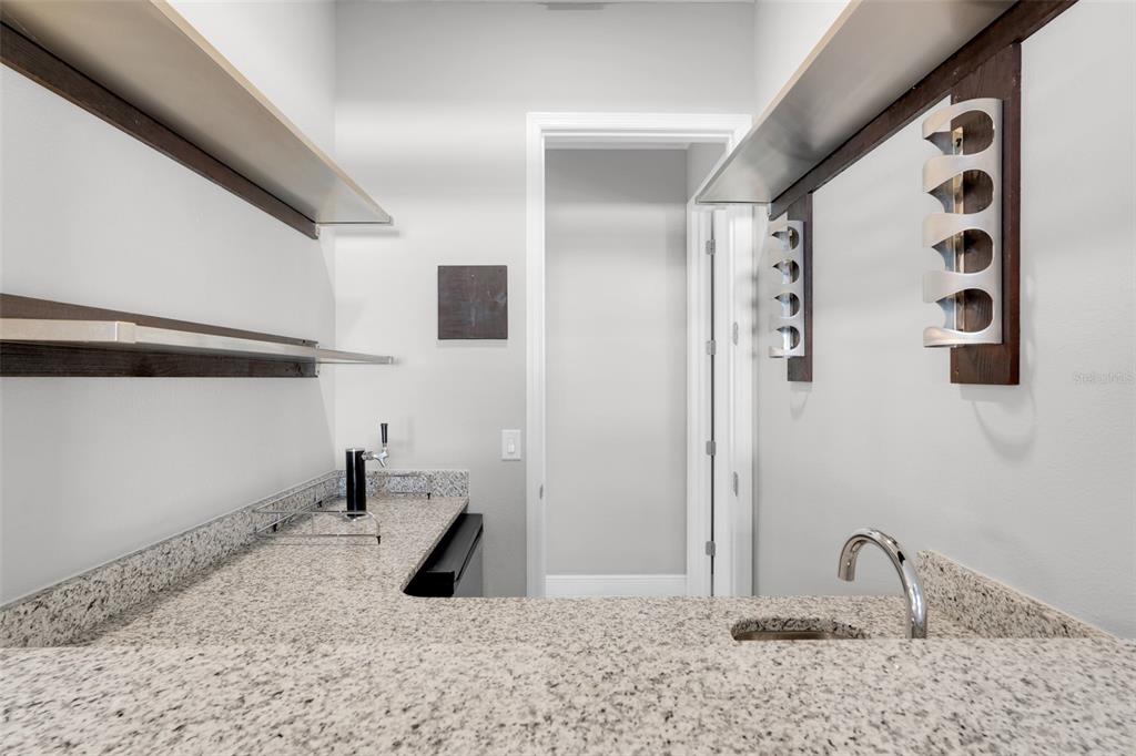 959 Maypole Drive Apopka, FL 32703 - Photo 16 of 44 a bathroom with a granite countertop sink and a mirror