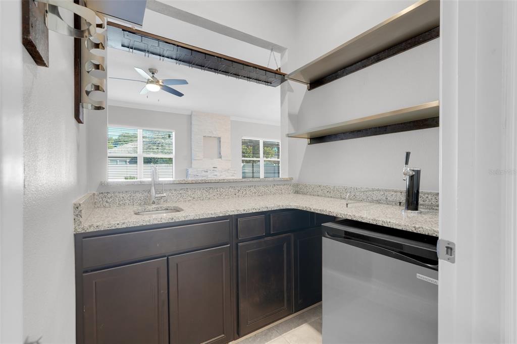 959 Maypole Drive Apopka, FL 32703 - Photo 17 of 44 a kitchen with a sink and cabinets
