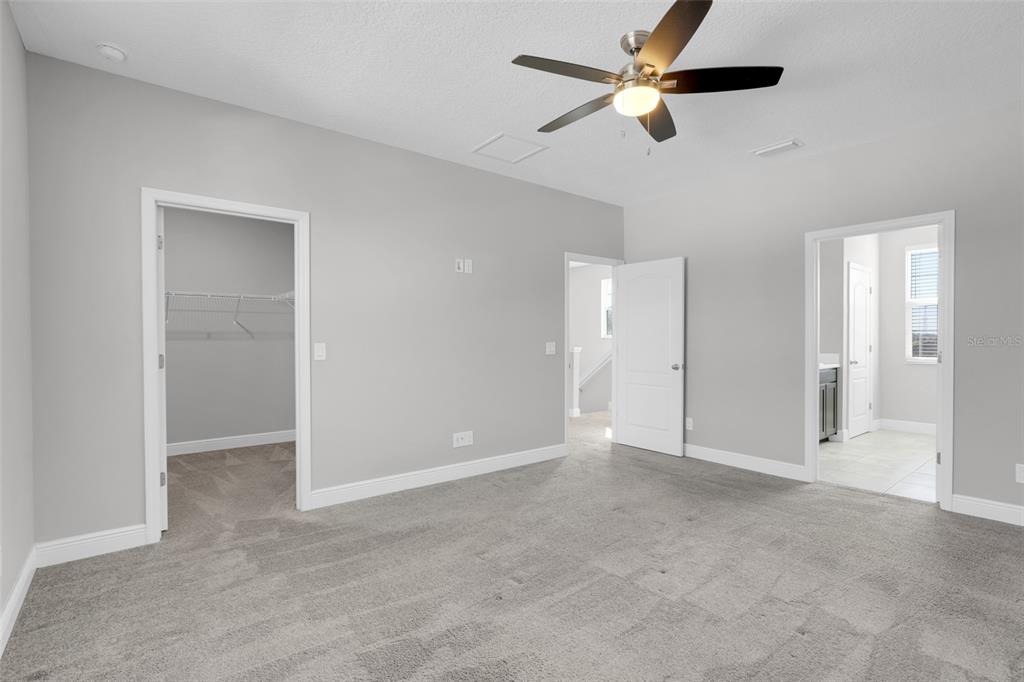 959 Maypole Drive Apopka, FL 32703 - Photo 21 of 44 a view of an empty room and a ceiling fan