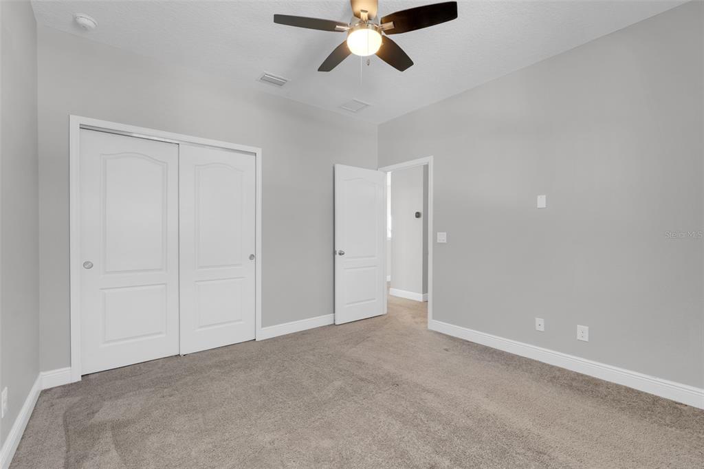 959 Maypole Drive Apopka, FL 32703 - Photo 28 of 44 a view of an empty room and chandelier fan