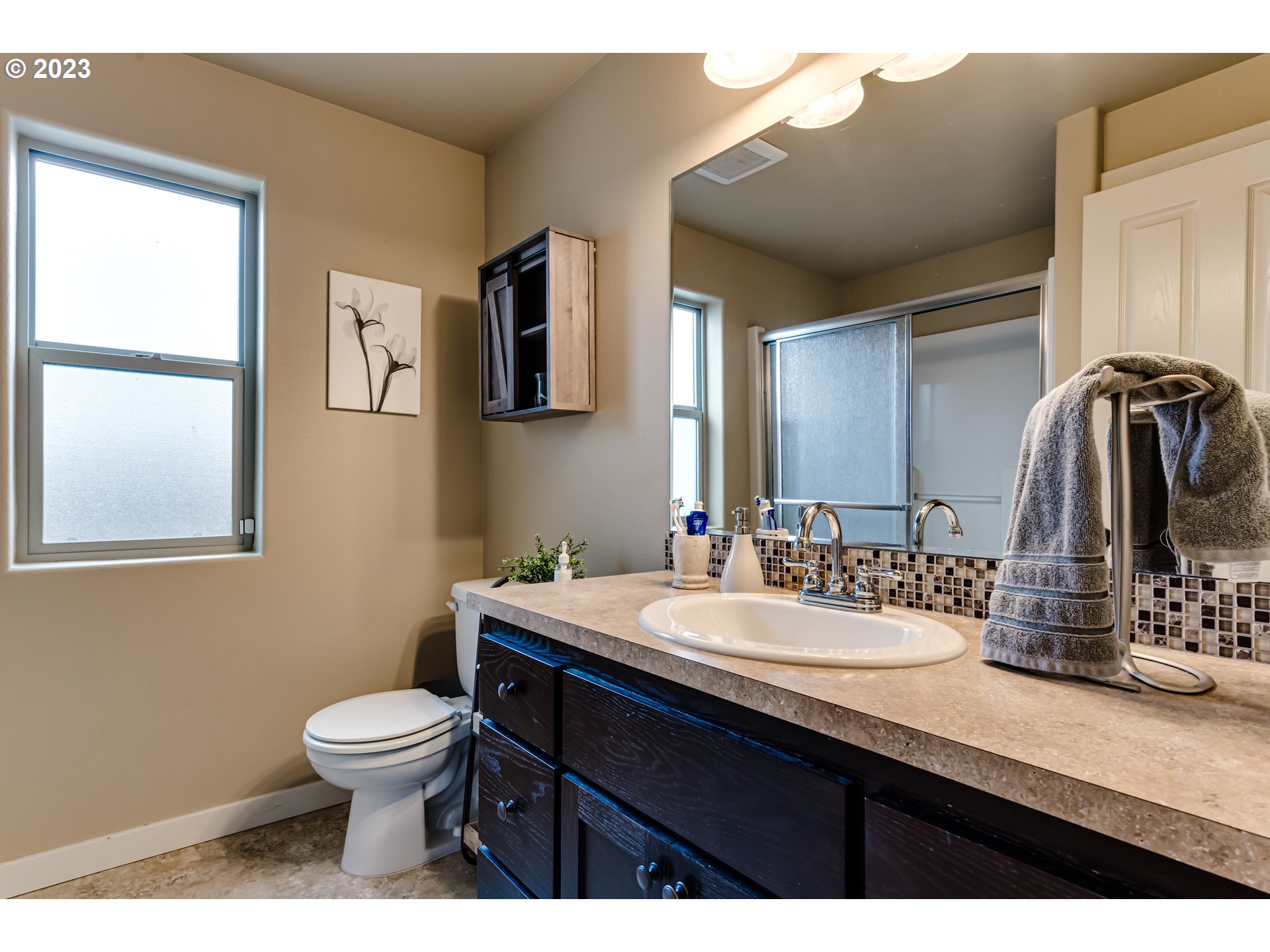 440 22nd Street Springfield, OR 97477 - Photo 17 of 31 a bathroom with a toilet sink and mirror