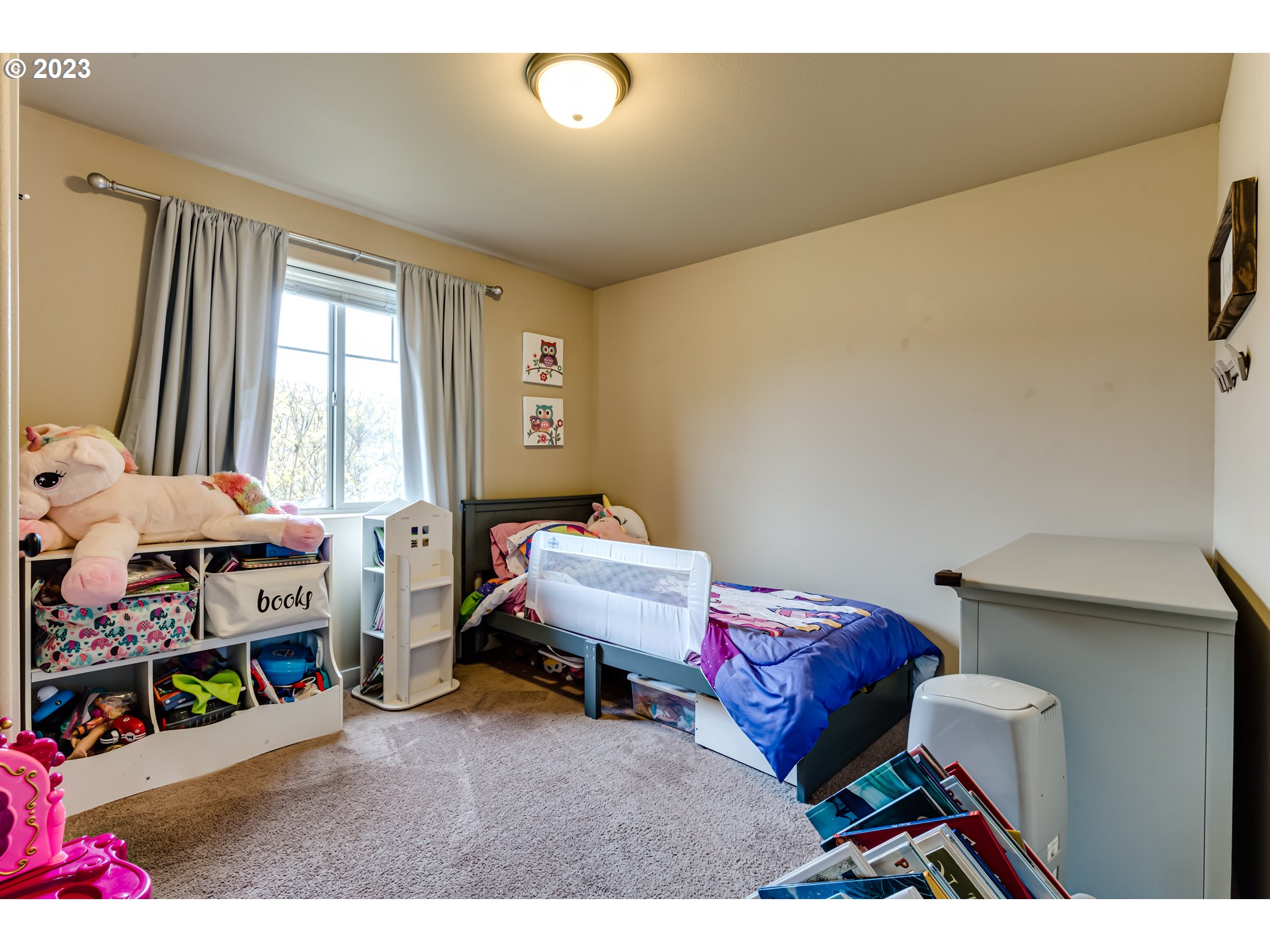 440 22nd Street Springfield, OR 97477 - Photo 21 of 31 a bedroom with a bed and a window