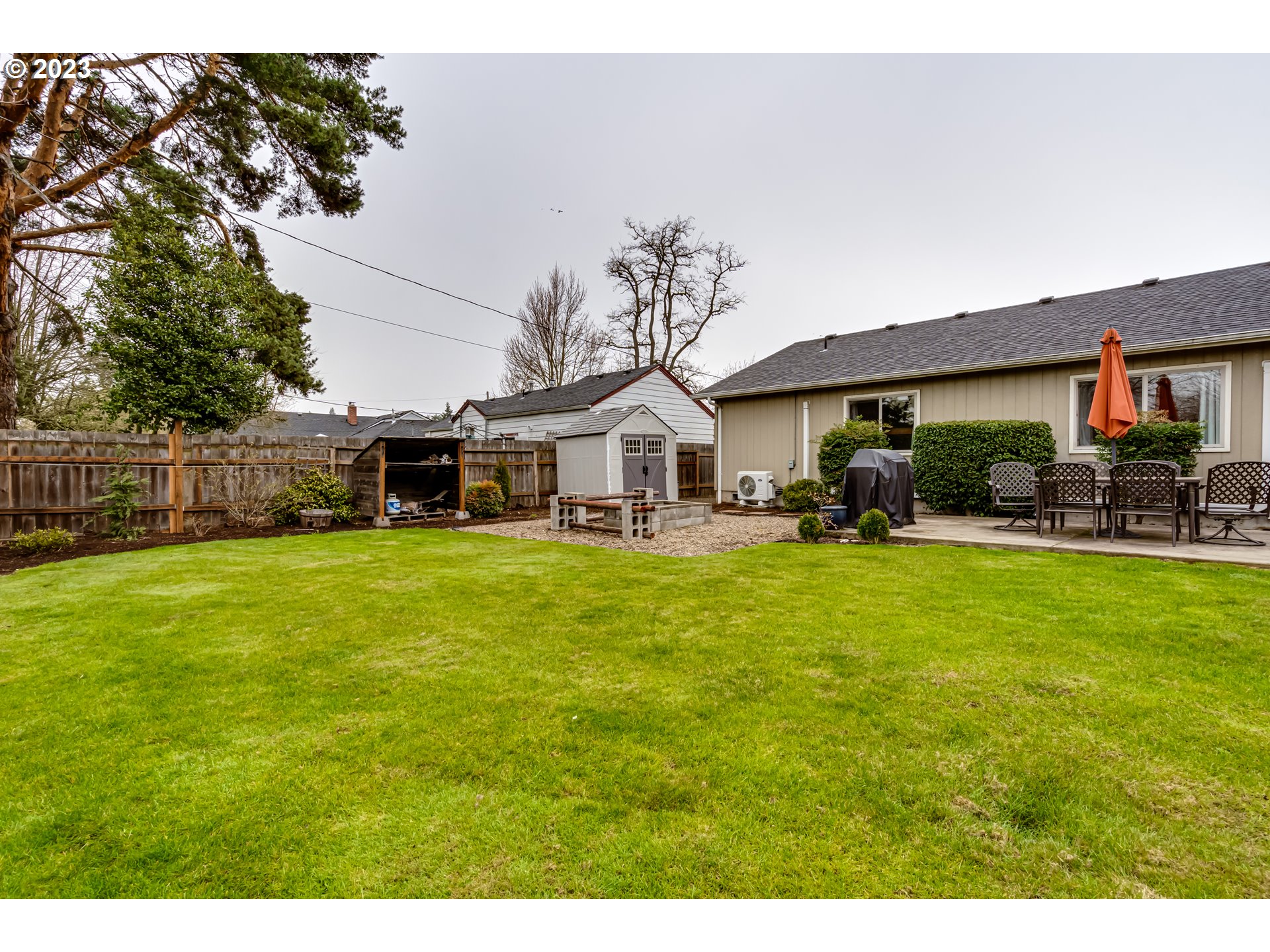 440 22nd Street Springfield, OR 97477 - Photo 25 of 31 a front view of a house with a garden and trees