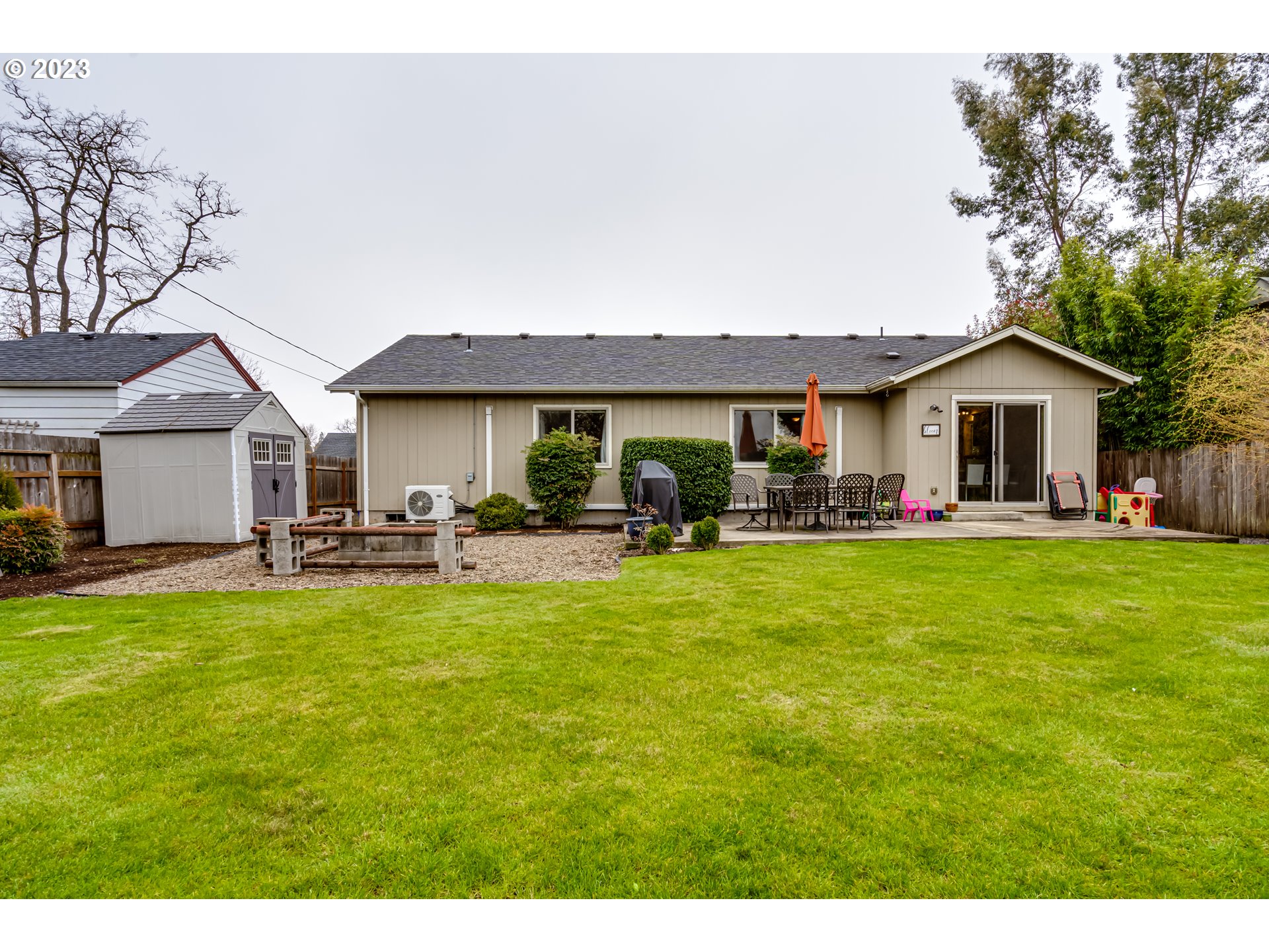440 22nd Street Springfield, OR 97477 - Photo 26 of 31 a front view of a house with a garden and patio