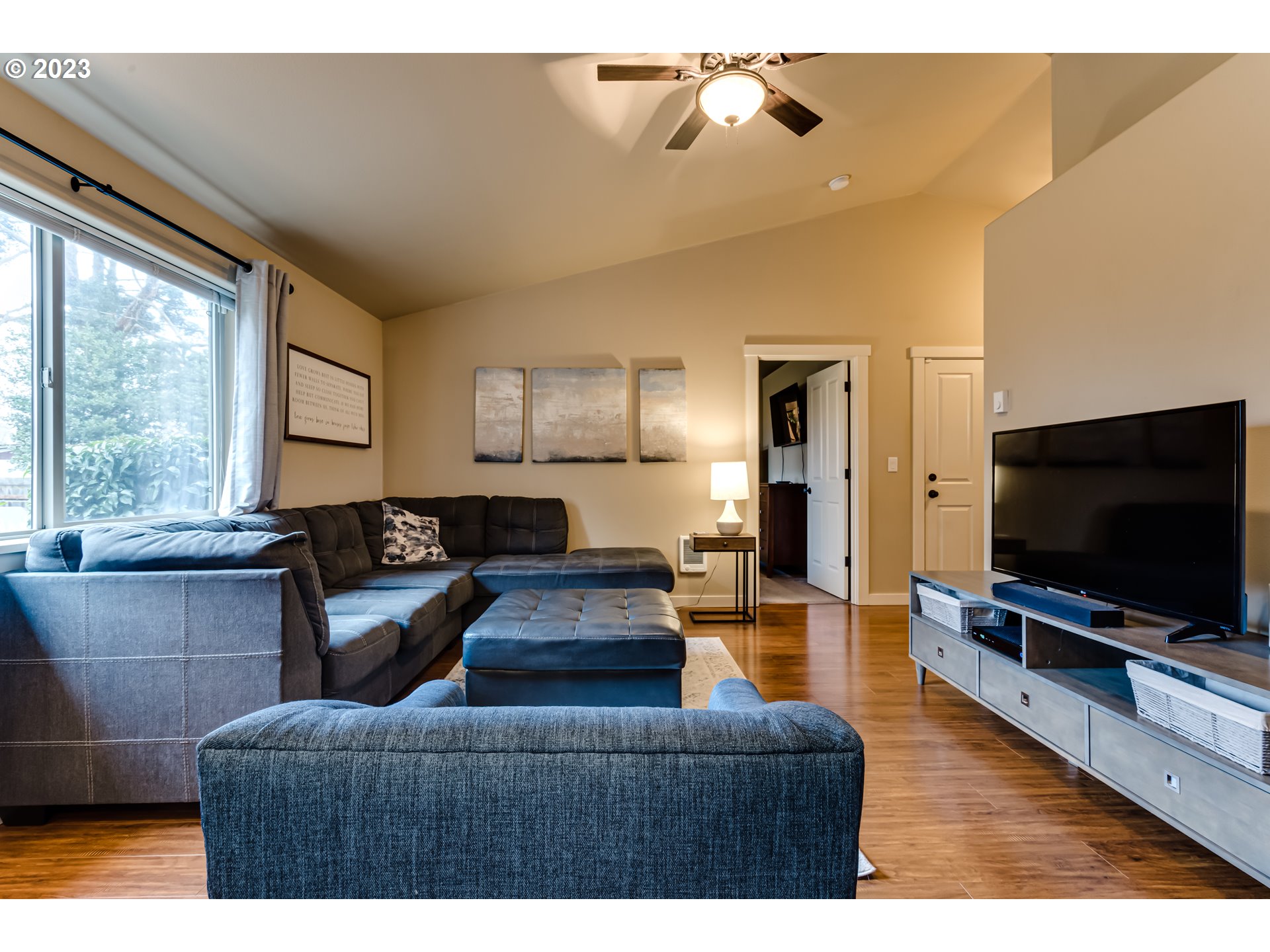 440 22nd Street Springfield, OR 97477 - Photo 5 of 31 a living room with furniture and a flat screen tv