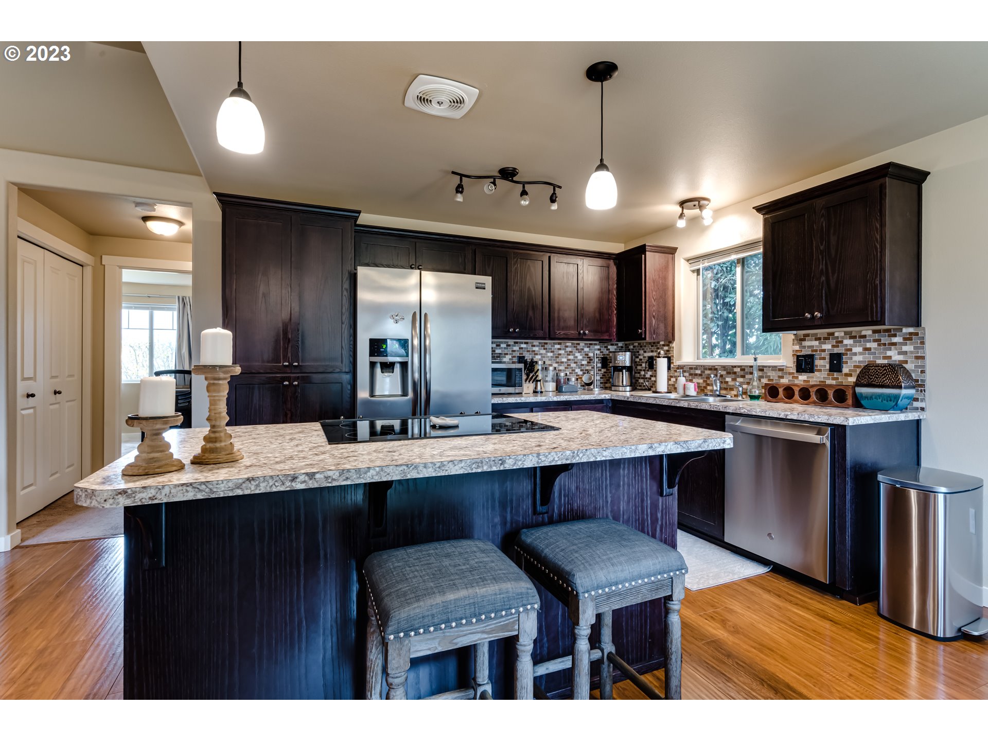 440 22nd Street Springfield, OR 97477 - Photo 8 of 31 a kitchen with counter space cabinets a sink and chairs