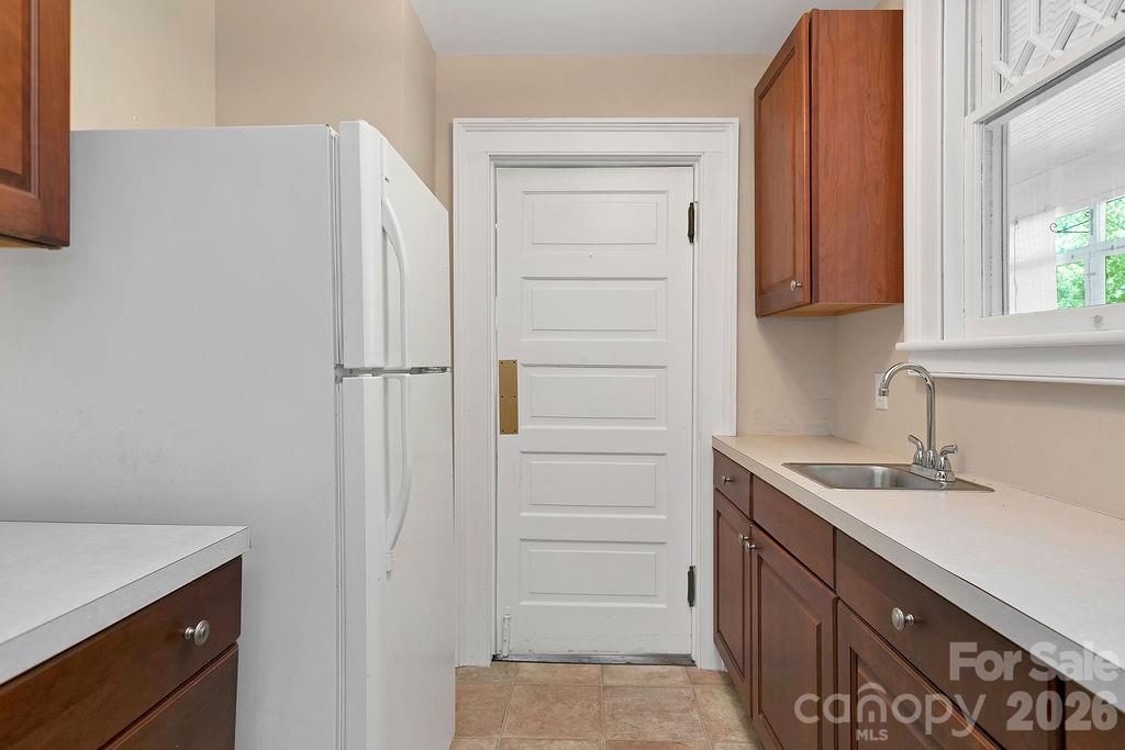 208 West Probart Street Brevard, NC 28712 - Photo 27 of 48 a bathroom with a sink and a mirror