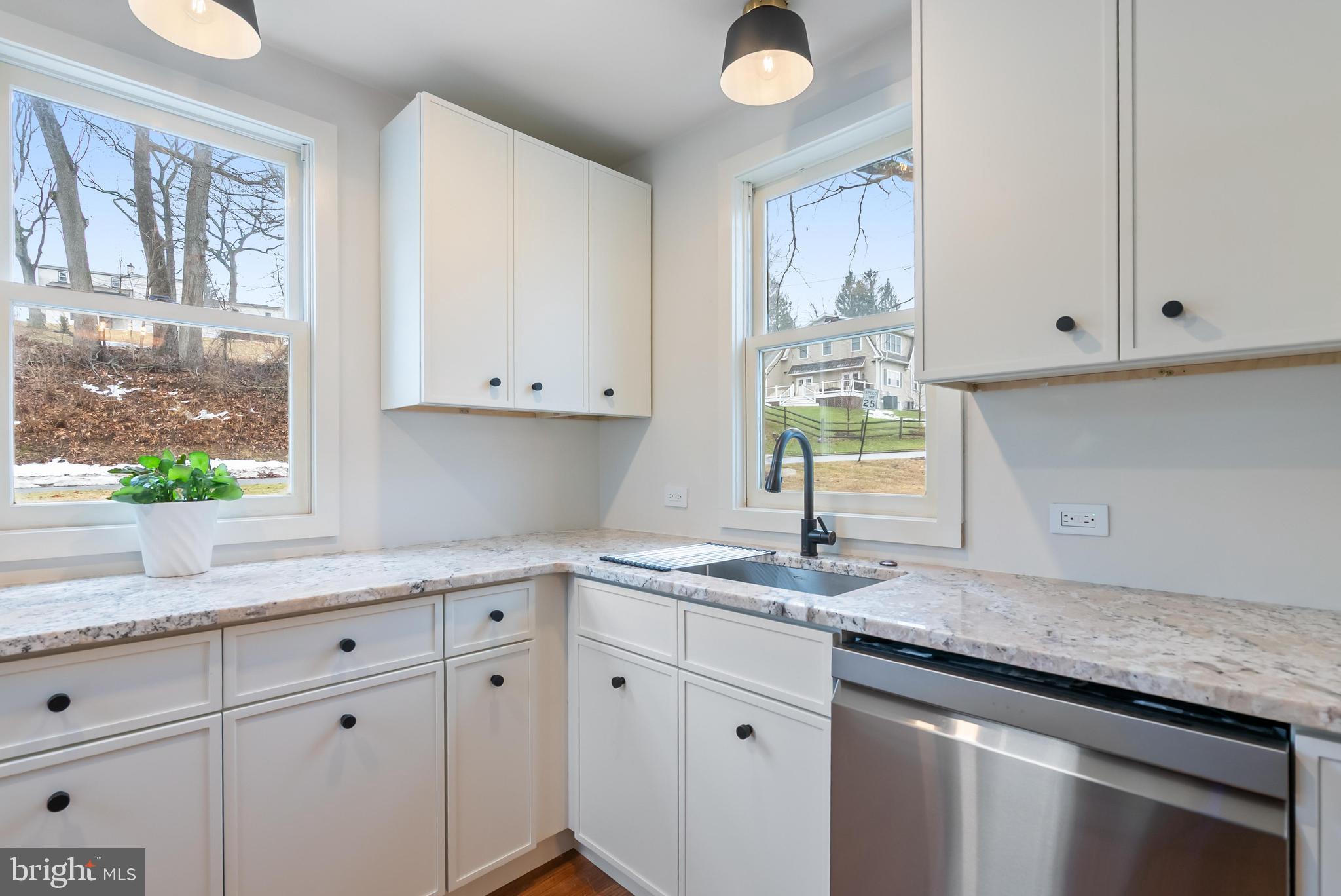 12 Longview Road Malvern, PA 19355 - Photo 16 of 44 Bright and airy kitchen with modern finishes.