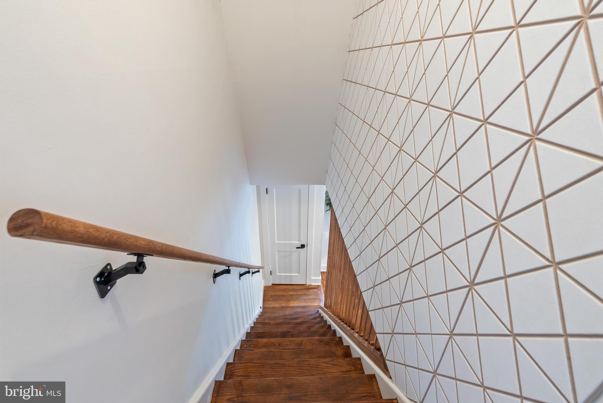 12 Longview Road Malvern, PA 19355 - Photo 26 of 44 Stylish staircase with geometric wall design.