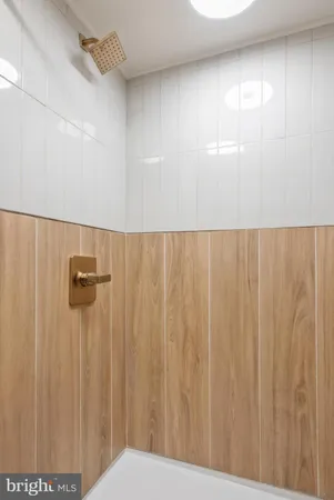 a view of a bathroom with shower curtain