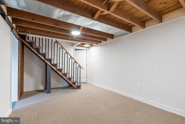 a view of an empty room with stairs
