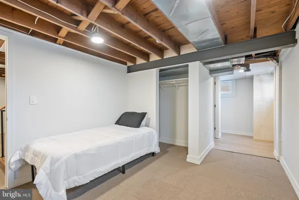 a bedroom with a bed and a walk in closet