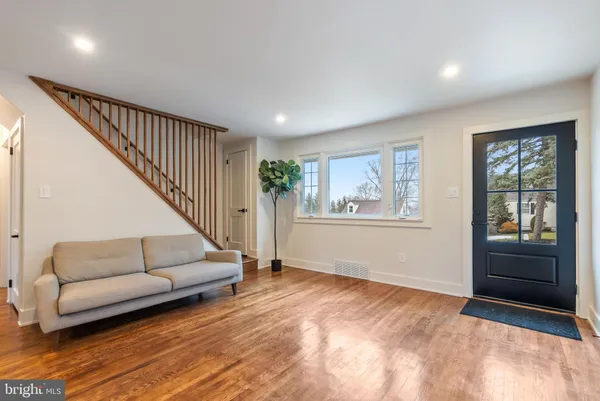a living room with furniture and windows