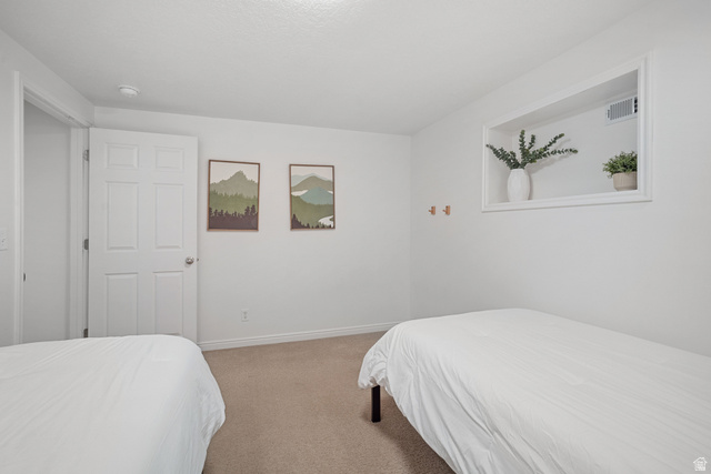 4426 South 3035 East Holladay, UT 84124 - Photo 28 of 49 Carpeted bedroom featuring baseboards