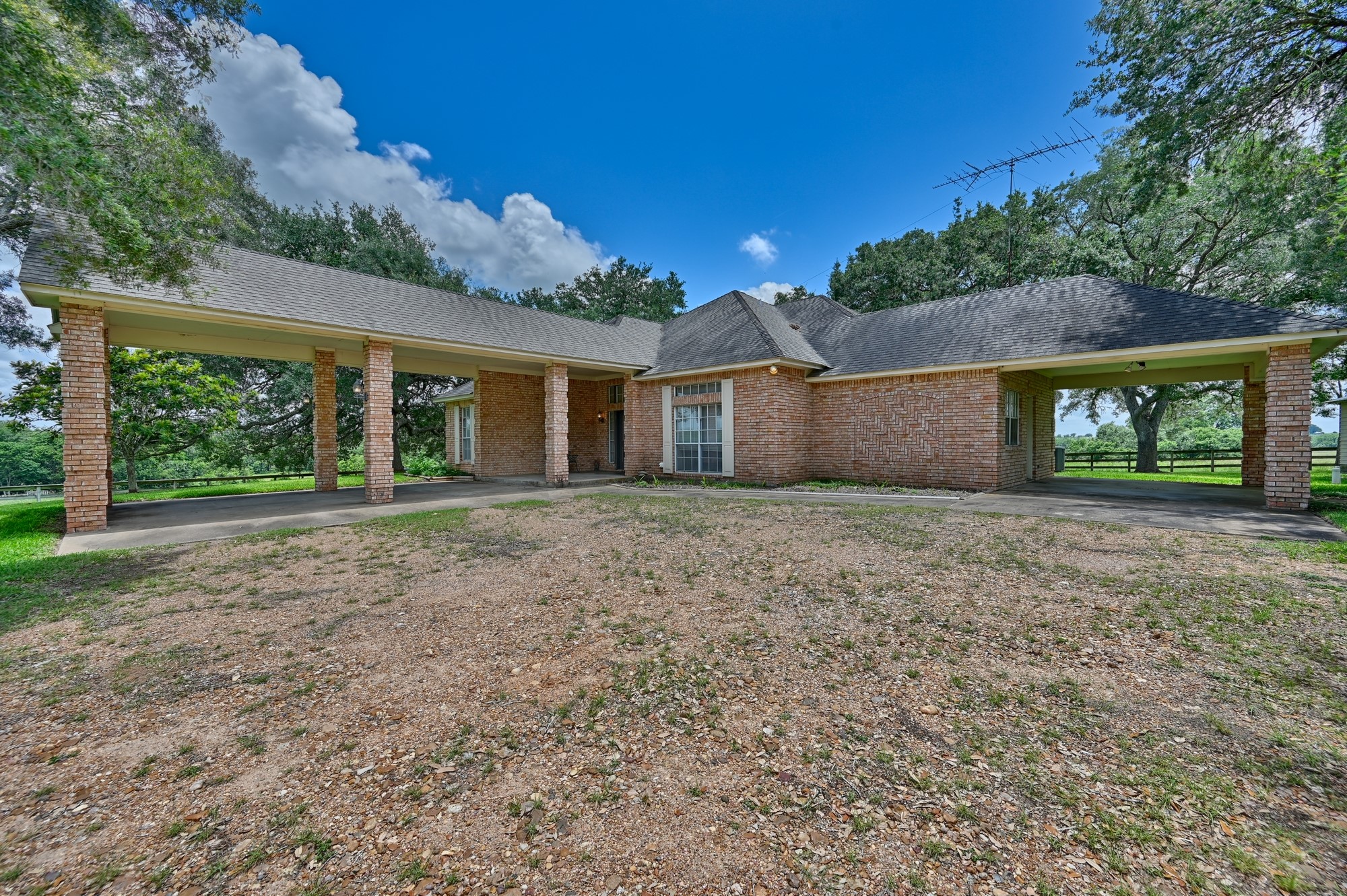 1552 Holub Road Schulenburg, TX 78956 - Photo 5 of 45 Two brick column carports offering space for 3 vehicles.
