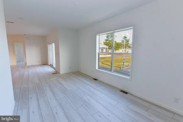 a view of a livingroom with wooden floor