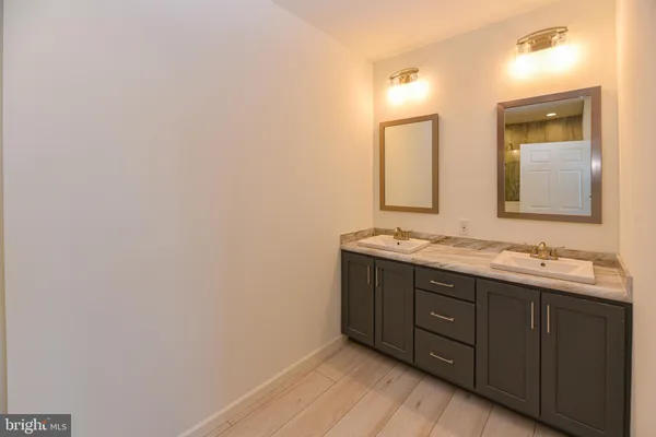 a bathroom with a shower a toilet and a sink