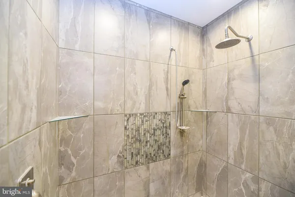 a bathroom with 2 sink and a mirror