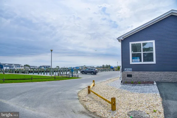 an aerial view of residential building and lake