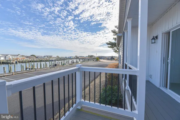 a view of balcony with wooden floor