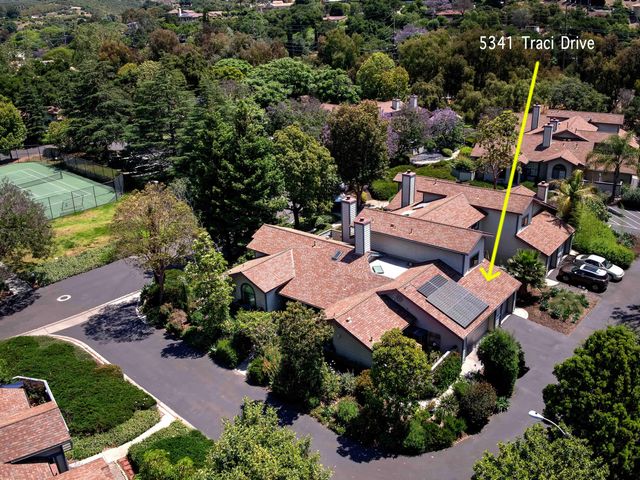 an aerial view of a houses with outdoor space and street view