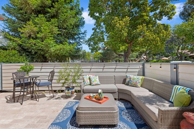a outdoor living space with furniture and garden view