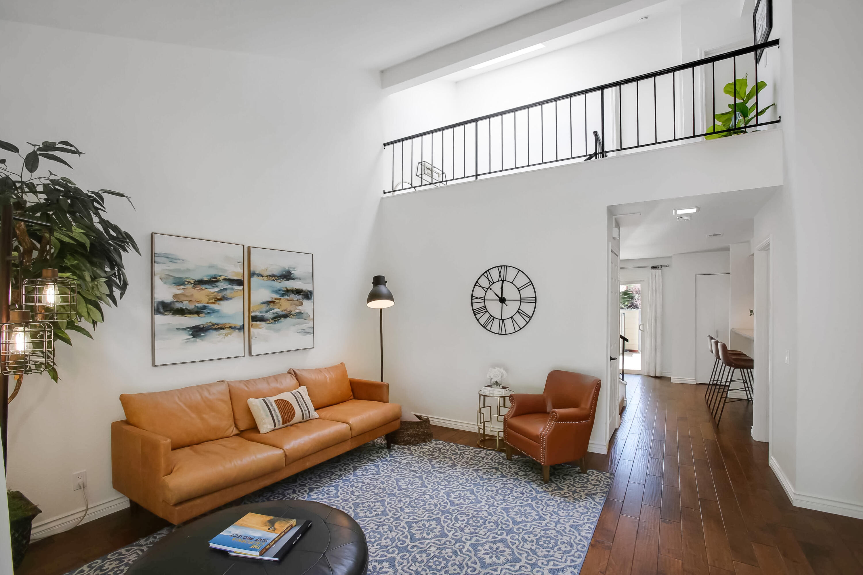 5341 Traci Drive Santa Barbara, CA 93111 - Photo 6 of 23 a living room with furniture a rug and a wall painting