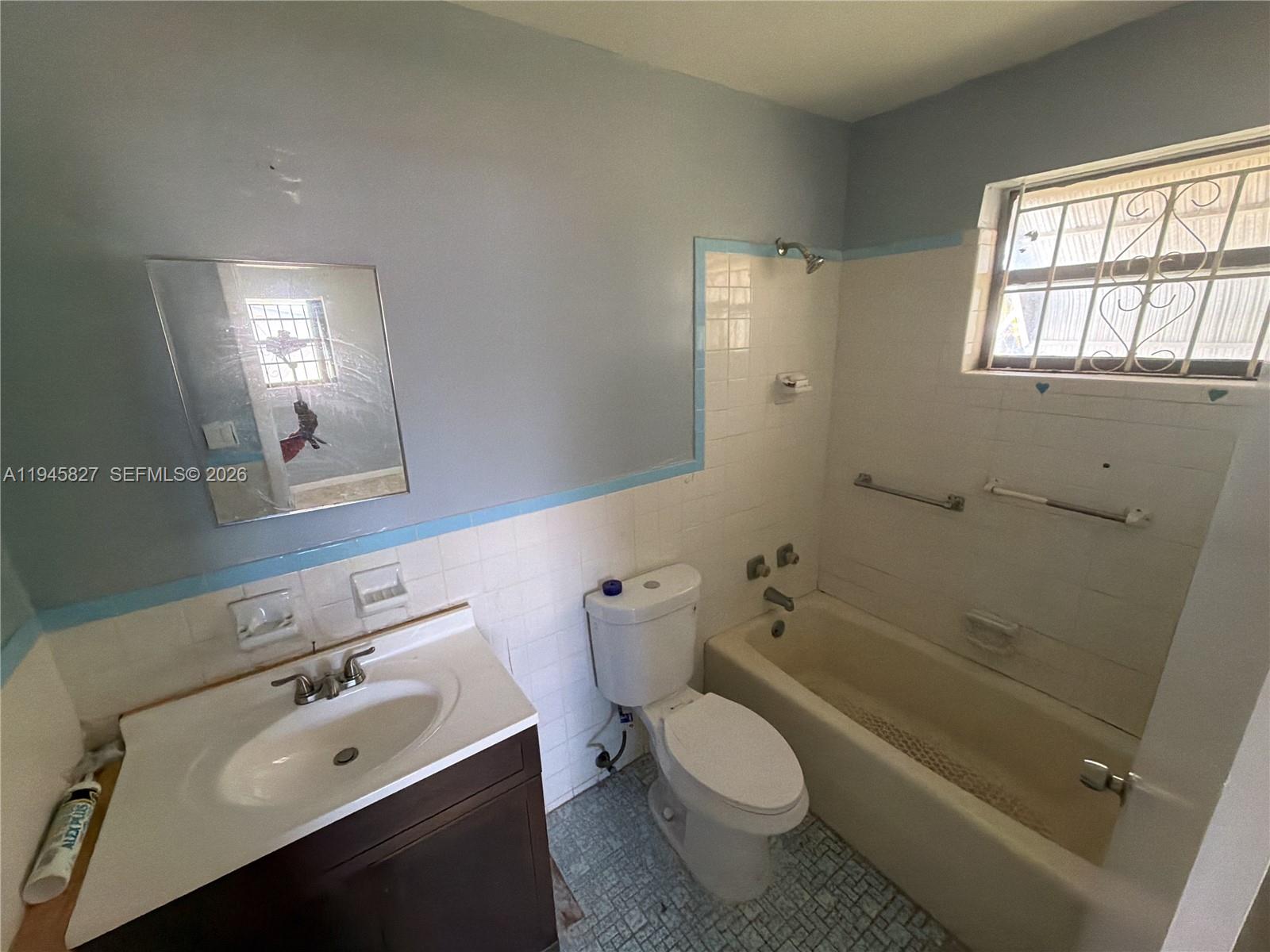 22192 Southwest 117th Avenue, Unit 1 Miami, FL 33170 - Photo 4 of 6 a bathroom with a sink toilet and shower