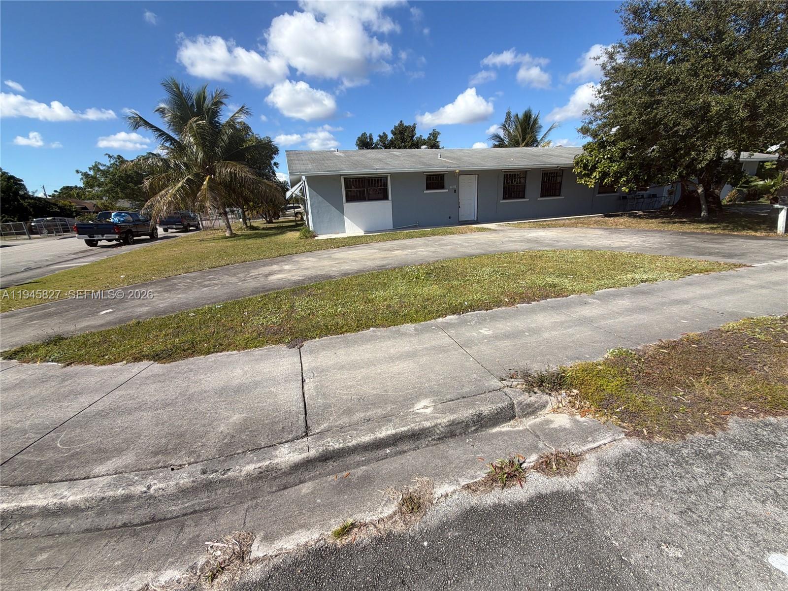 22192 Southwest 117th Avenue, Unit 1 Miami, FL 33170 - Photo 6 of 6 a view of a house with a yard