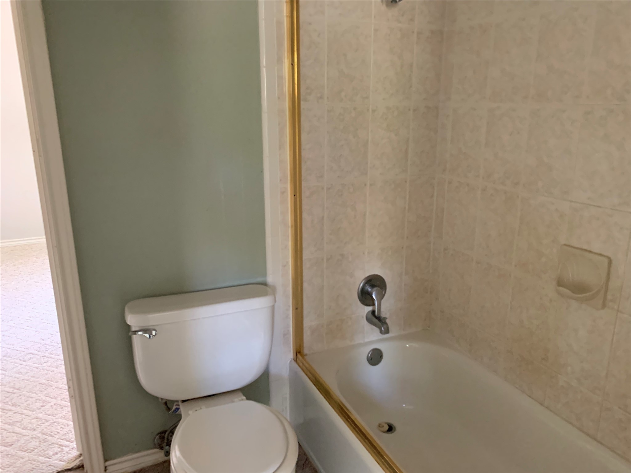 4722 Woodside Street Houston, TX 77023 - Photo 15 of 24 a bathroom with a toilet and sink