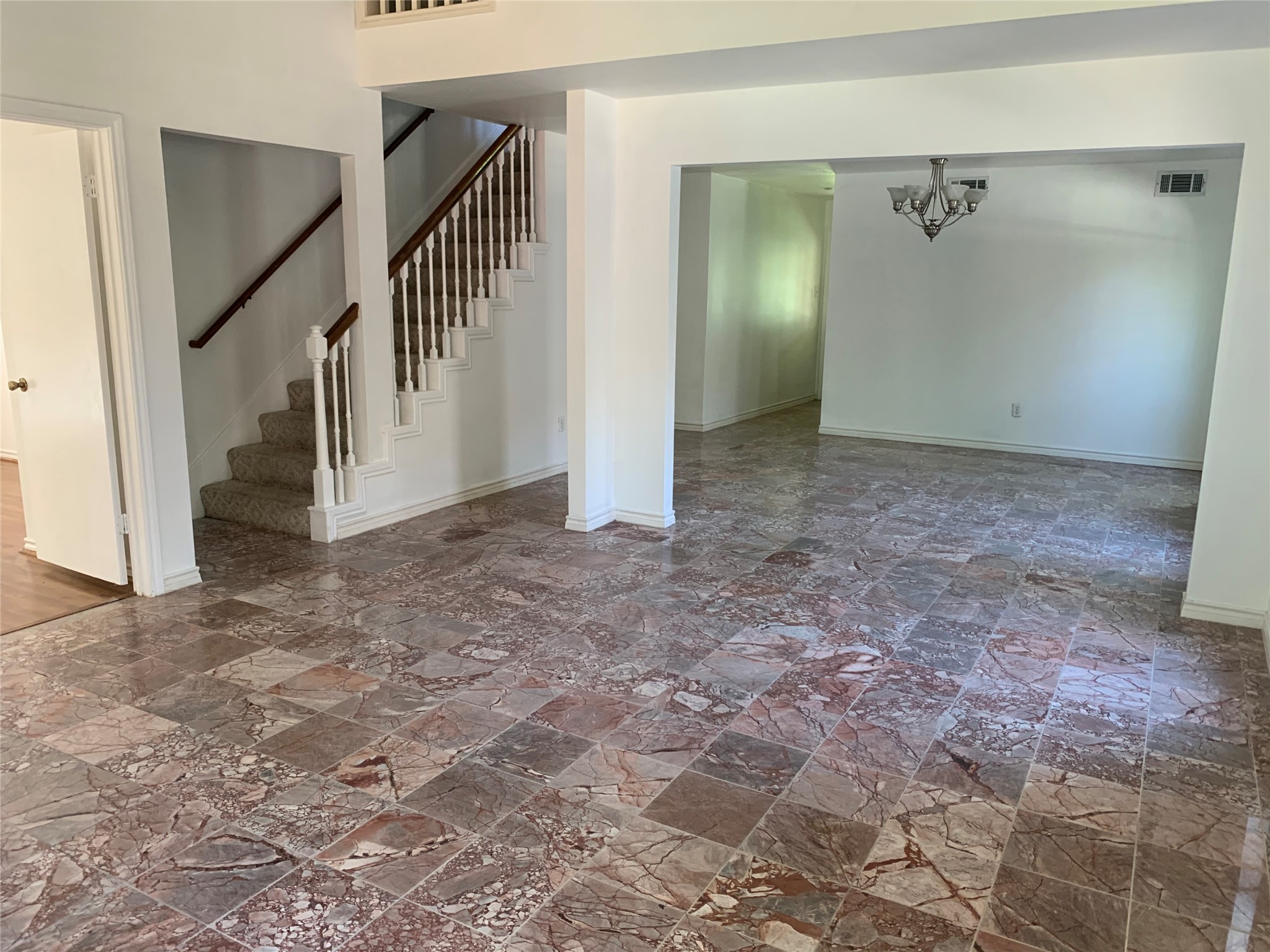 4722 Woodside Street Houston, TX 77023 - Photo 8 of 24 a view of a hallway with staircase