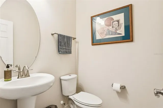 a bedroom with a bed a couch and a window