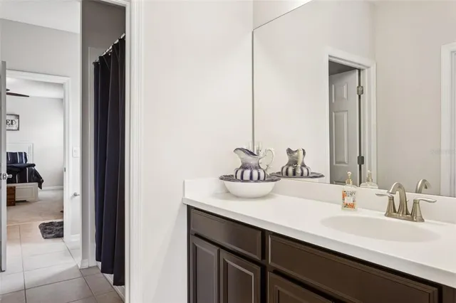 a bathroom with double sink and a mirror