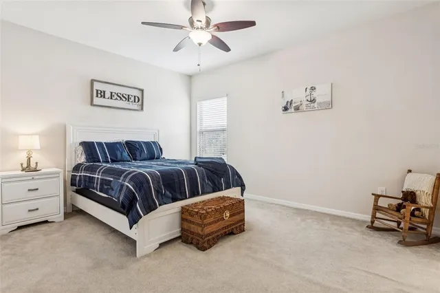 a bathroom with a toilet sink and a window