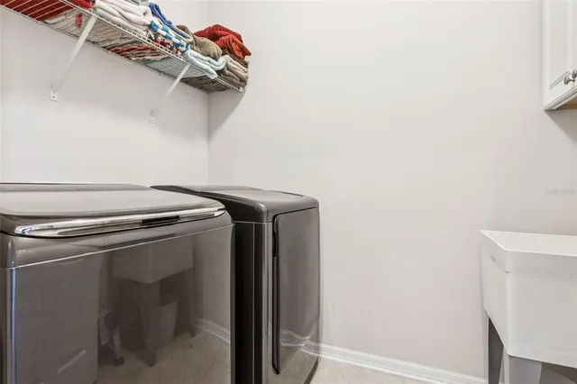 an aerial view of residential house with outdoor space and lake view