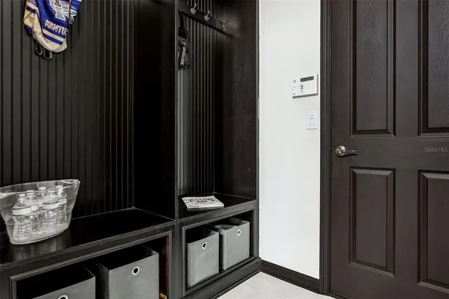 an aerial view of a house with a lake view