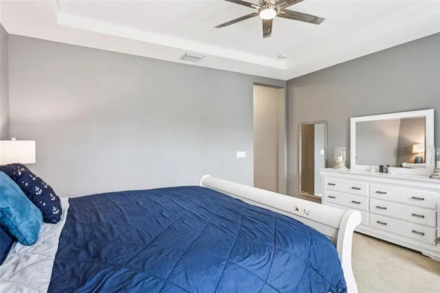 an aerial view of house with yard and lake