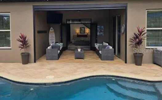 an aerial view of a house with a lake view