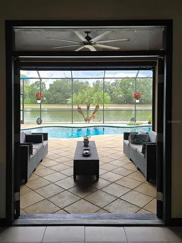 an aerial view of a house with garden space sitting space and swimming pool