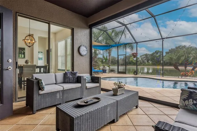 a aerial view of a house next to a yard