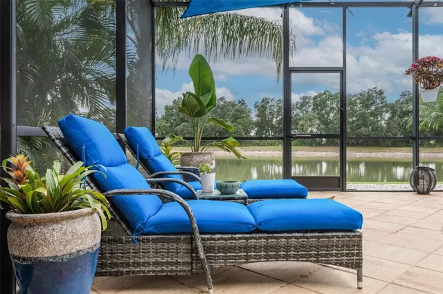 an aerial view of a house with a garden and lake view