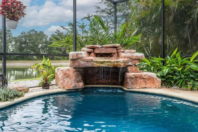 a view of a white house with a swimming pool