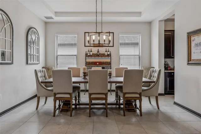 a living room with furniture a fireplace and a rug