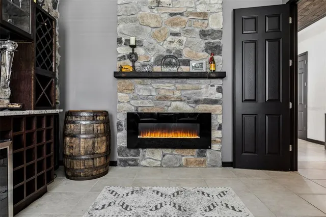 a dining room with furniture a chandelier and window