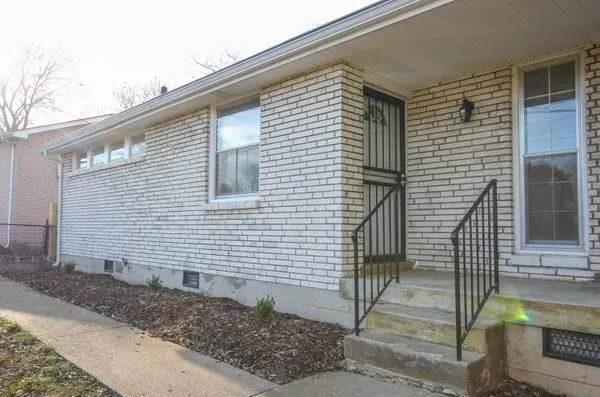 a view of a house with a door and wooden floor